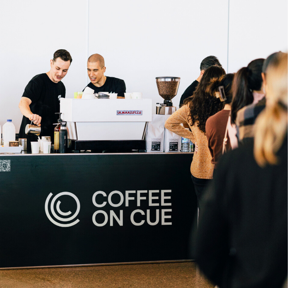 Baristas Serving Delegates At Conference Event